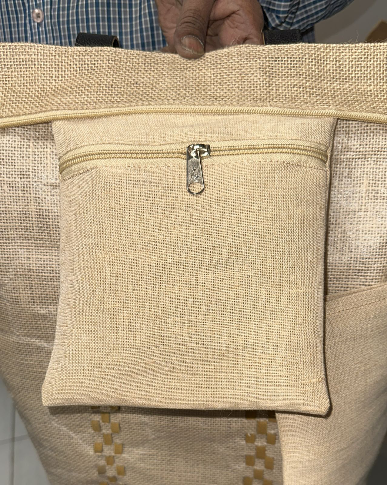 Zip pocket fitted inside a Tigris tote bag.